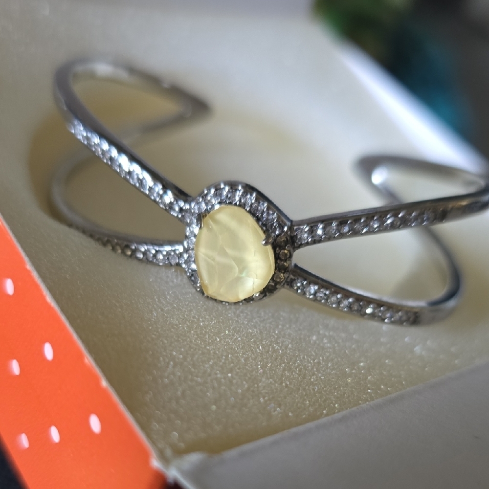 Elegant Silver and Cream Bracelet